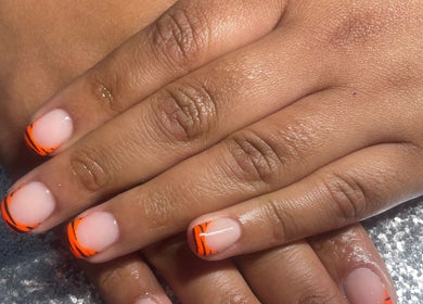 Orange French tip nails at The Glam and Glow Studio, Havant, England, GB.