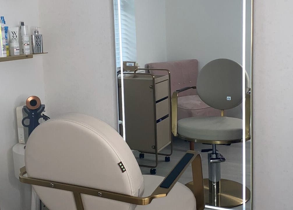 Modern salon interior at Doll Hair By Lara, Leicester, England, GB, featuring stylish seating and beauty products.