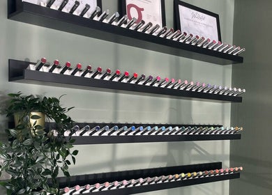 Nail polish collection on shelves at CHELS xo NAILS - BIAB Gel Specialist, Yeovil, England, GB.