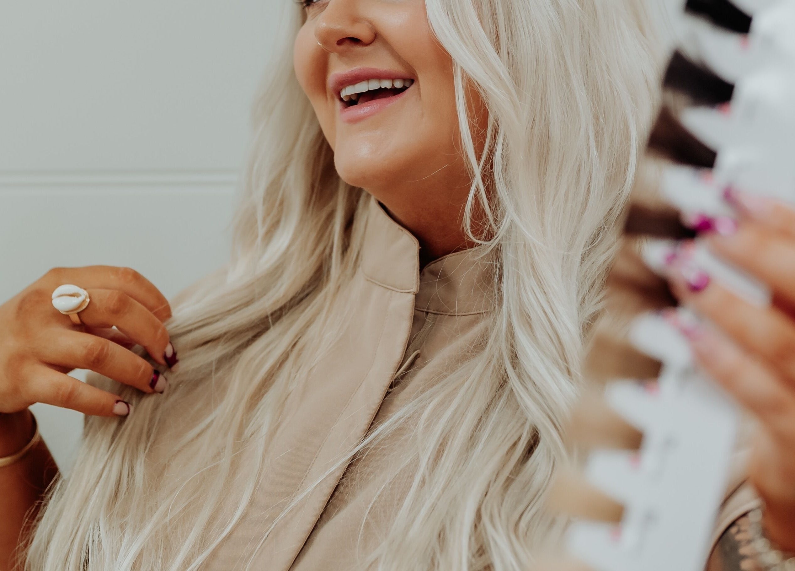 Woman with radiant blonde hair smiling at Blonde & Boujee Boutique, Tannum Sands, Queensland, AU.