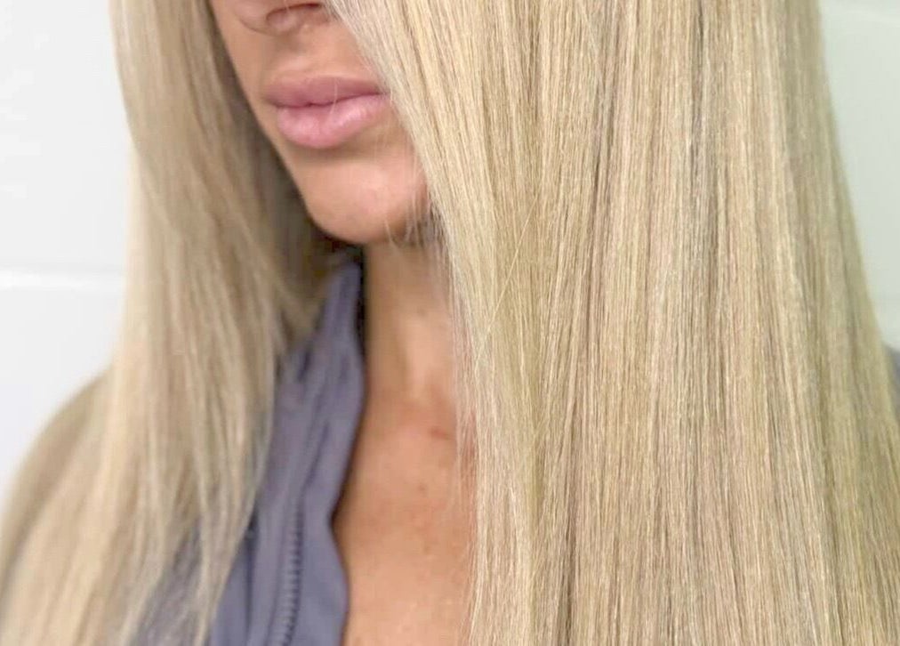 Close-up of smooth, silky blonde hair styled at Blonde & Boujee- Tannum Sands, Queensland, AU.
