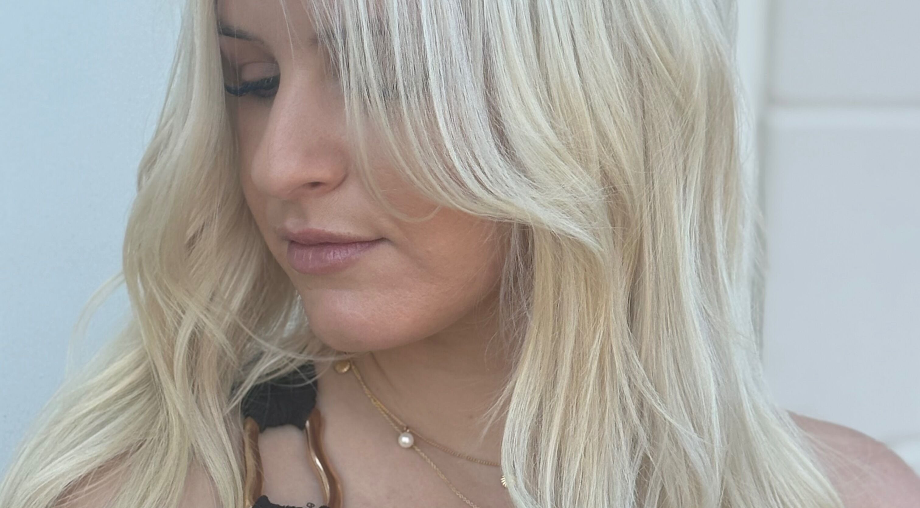 Close-up of a woman with blonde hair at Blonde & Boujee- Tannum Sands, Queensland, AU.