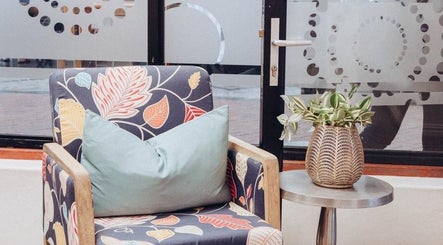 Stylish chair and plant decor at Norma Jeans Hair, Nails & Beauty Salon, Port Elizabeth, Eastern Cape, ZA.
