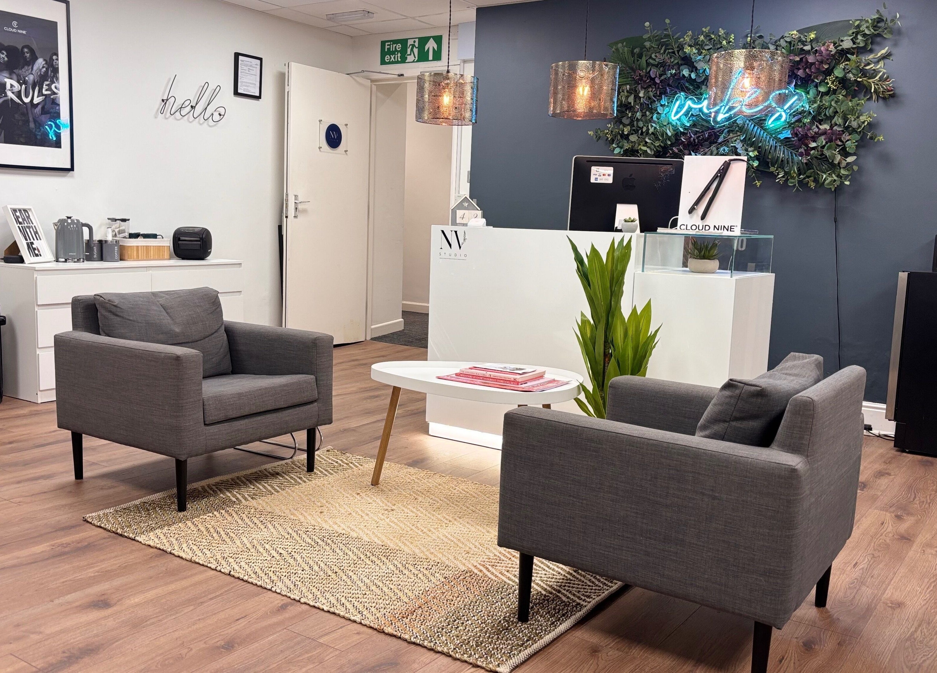 Welcoming lounge area at Nv Studio in Exeter, England, GB, featuring modern seating and stylish decor.
