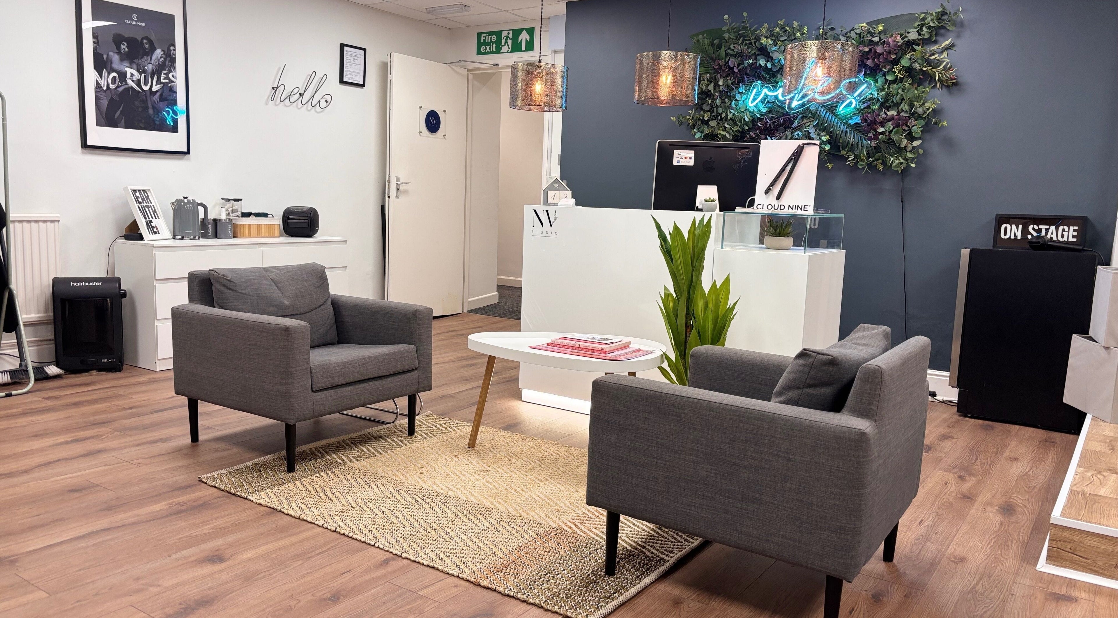 Welcoming lounge area at Nv Studio in Exeter, England, GB, featuring modern seating and stylish decor.