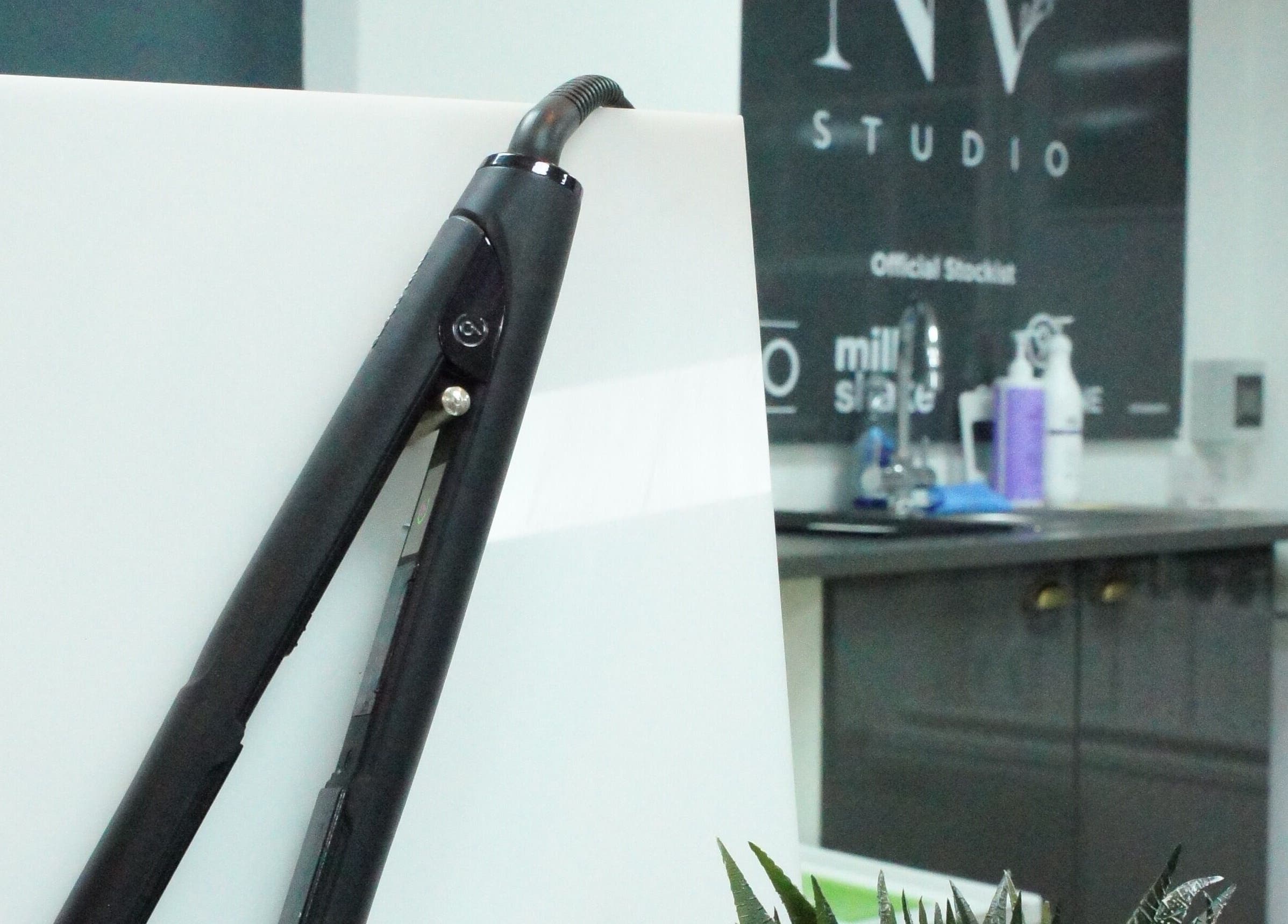 Flat iron and salon tools at Nv Studio, Exeter, England, GB, showcasing a modern beauty workspace.