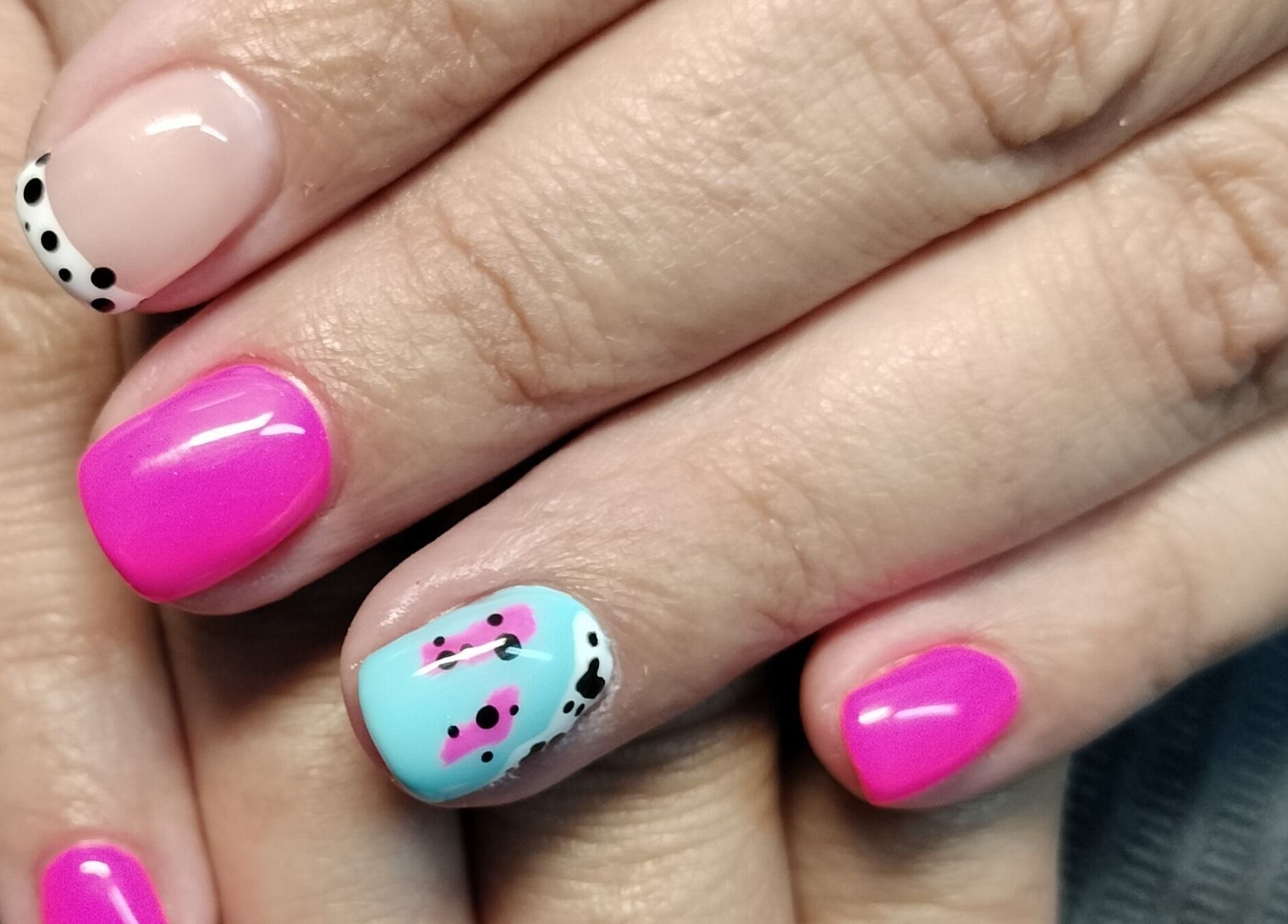 Vibrant nails at Beautify at Bella Mia, Potchefstroom, ZA, showcasing a unique pink and blue design.