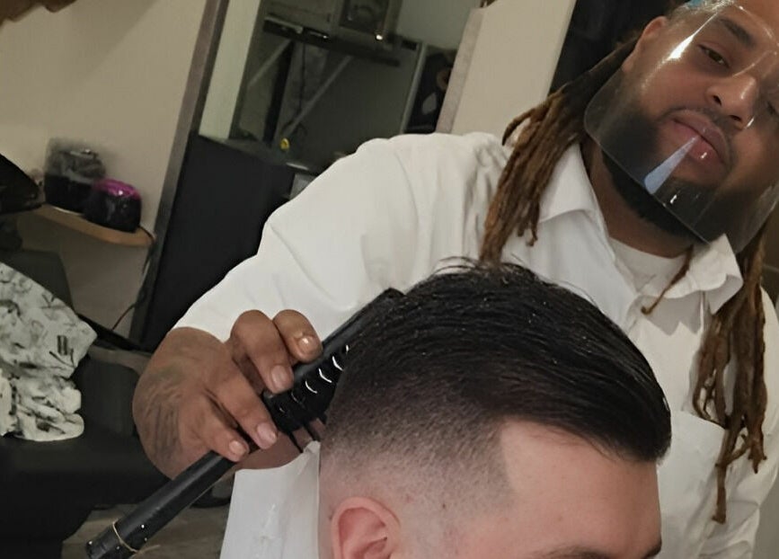 Professional stylist at Freestyle - Long Crendon crafting a precise haircut, Long Crendon, England, GB.