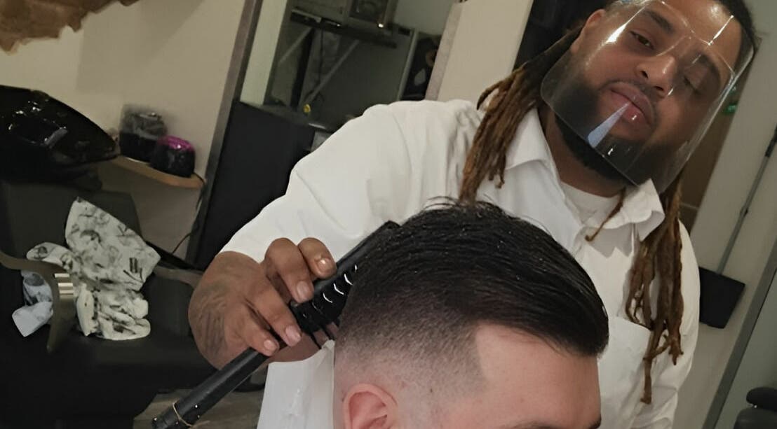 Professional stylist at Freestyle - Long Crendon crafting a precise haircut, Long Crendon, England, GB.