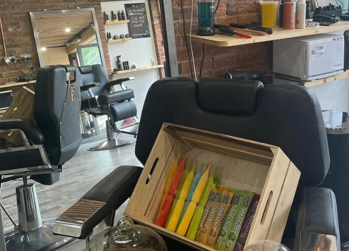 Modern salon setup at Freestyle - Long Crendon in Long Crendon, England, GB with sleek styling chairs and products.