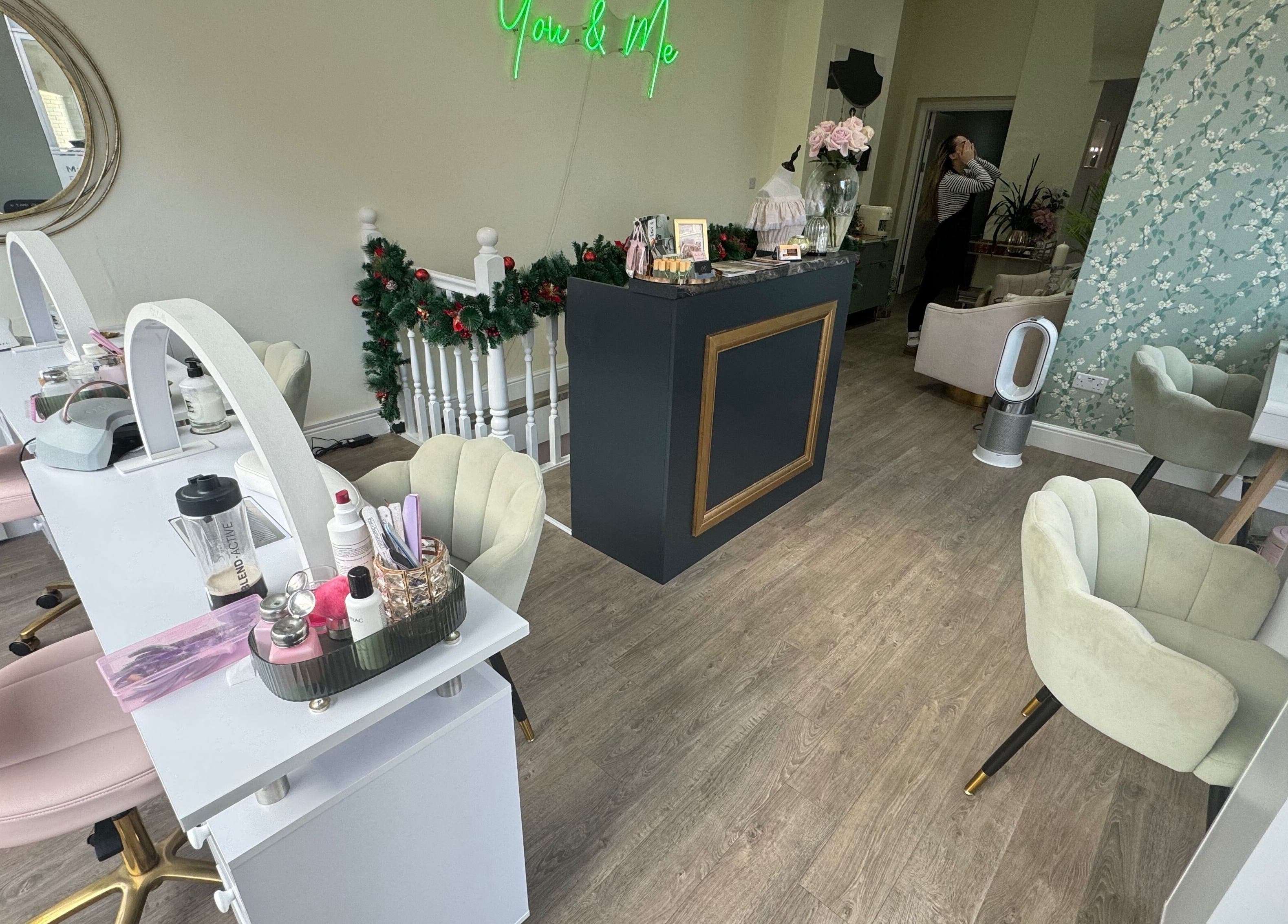 Interior of GLAM FACES CLINIC in London, England, GB showcasing elegant beauty stations and modern decor.