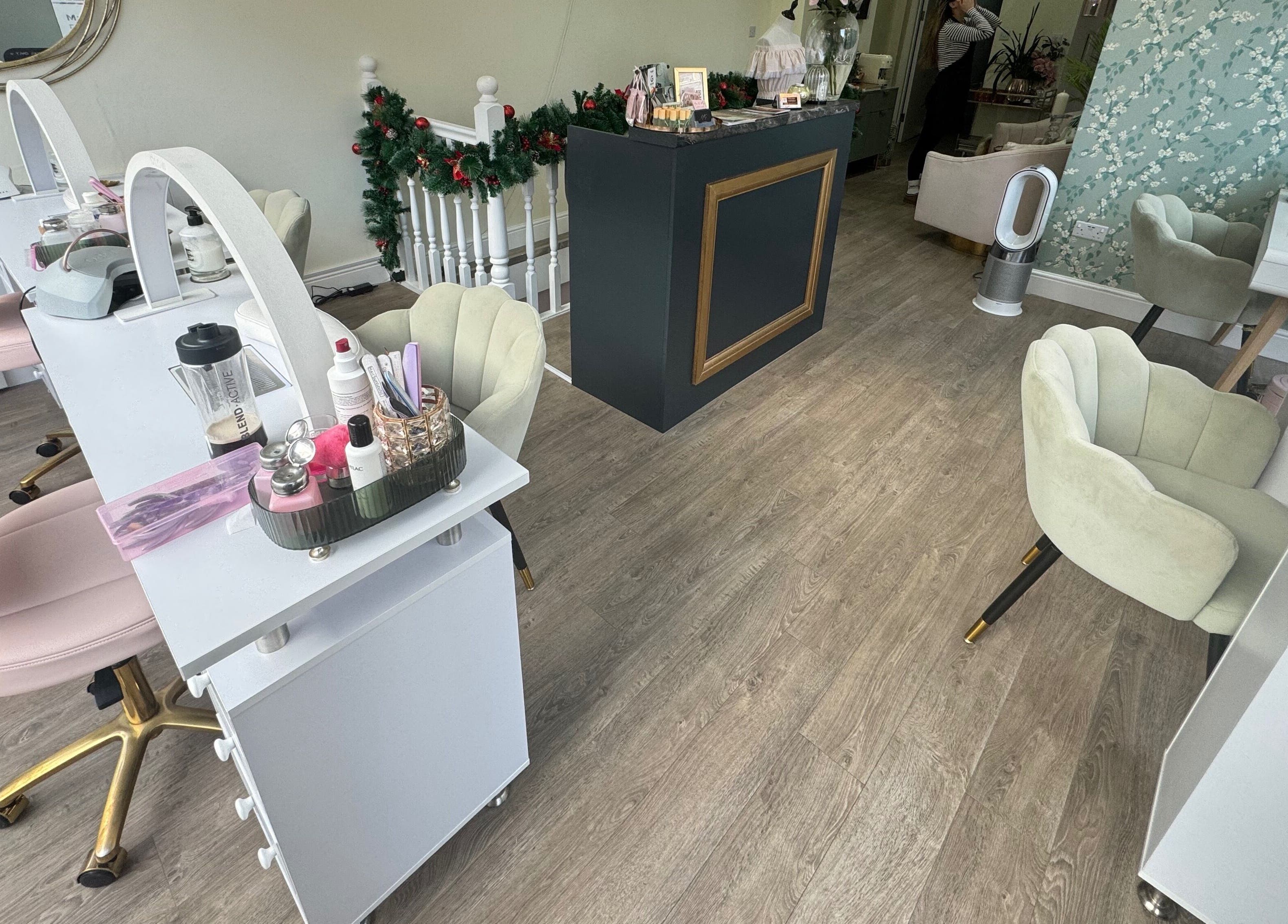 Chic beauty station at GLAM FACES CLINIC, London, England, GB, featuring plush chairs and grooming essentials.