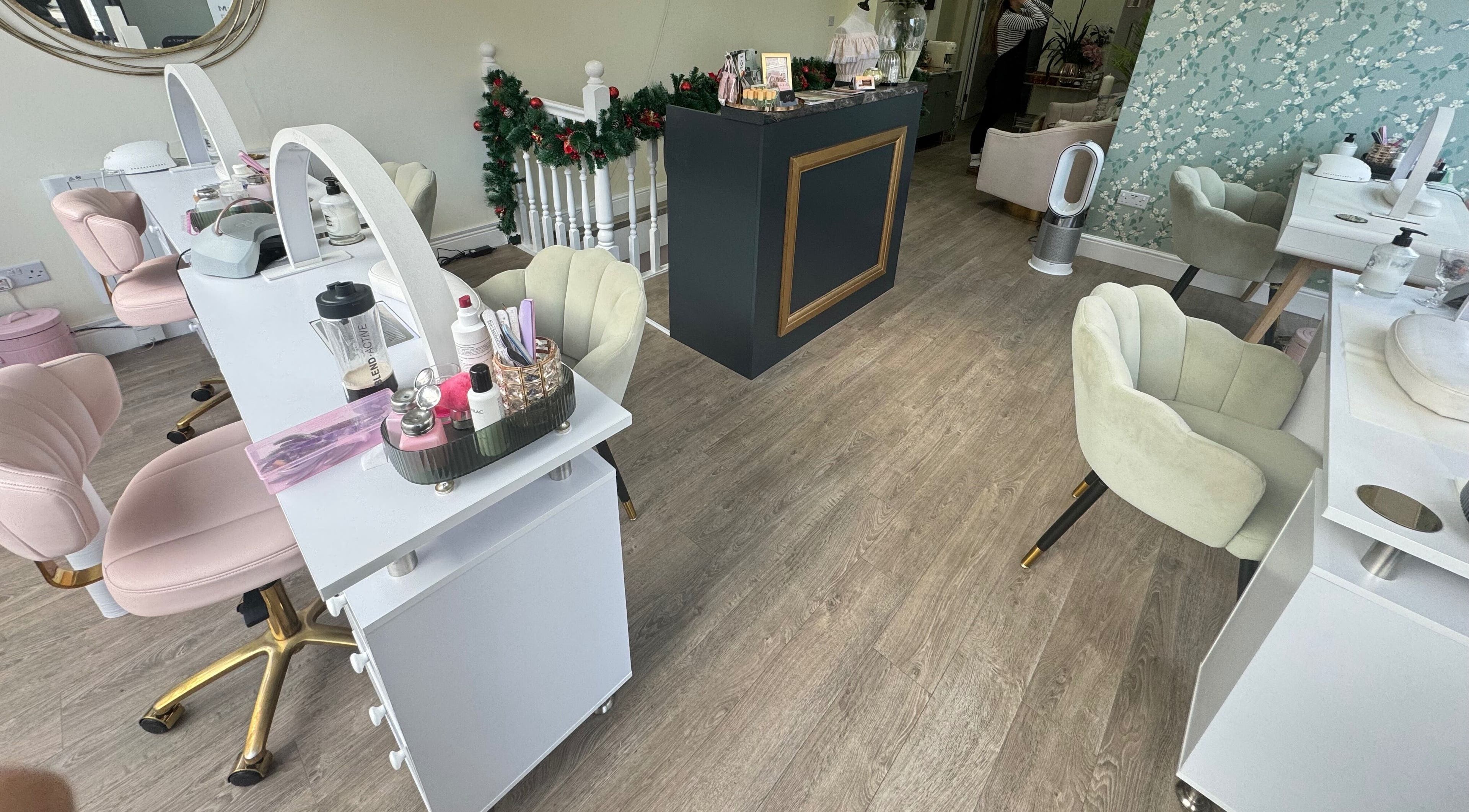 Chic beauty station at GLAM FACES CLINIC, London, England, GB, featuring plush chairs and grooming essentials.