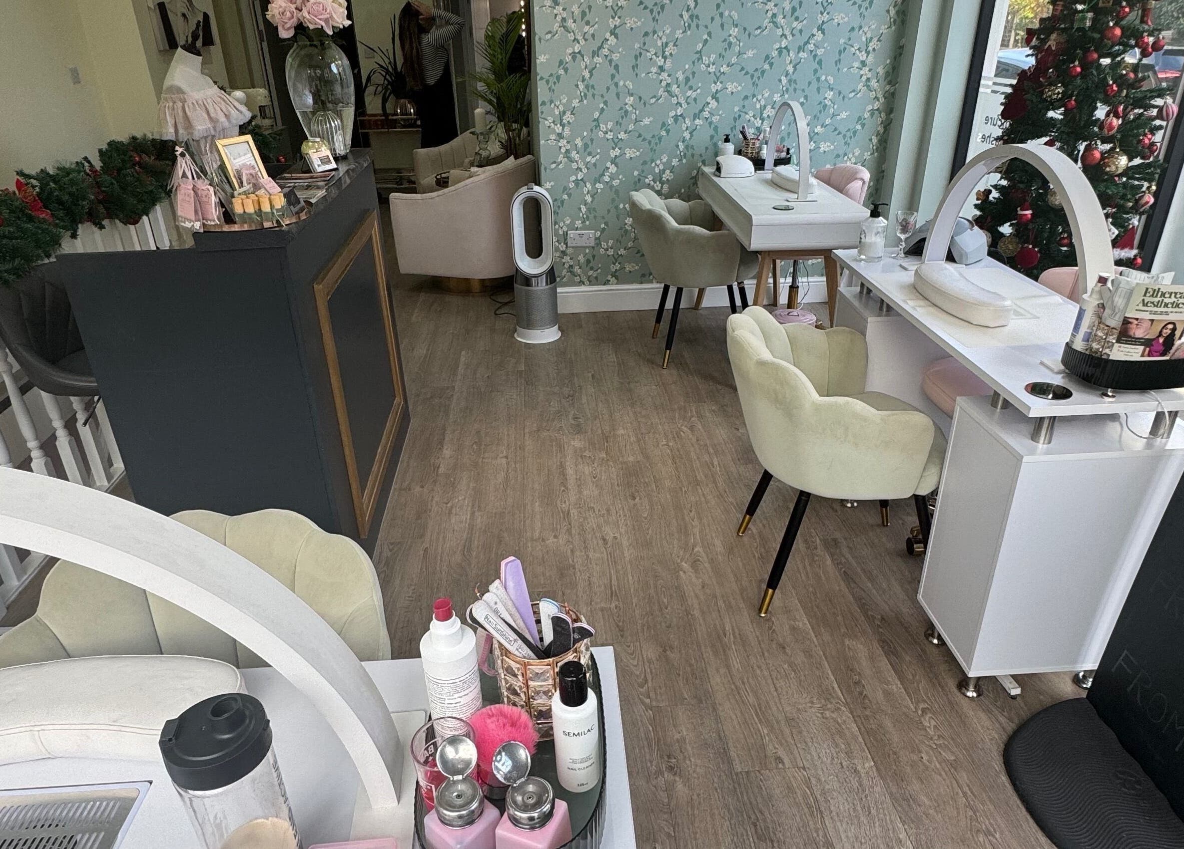 Chic interior of GLAM FACES CLINIC, London, England, GB with elegant seating and decor.