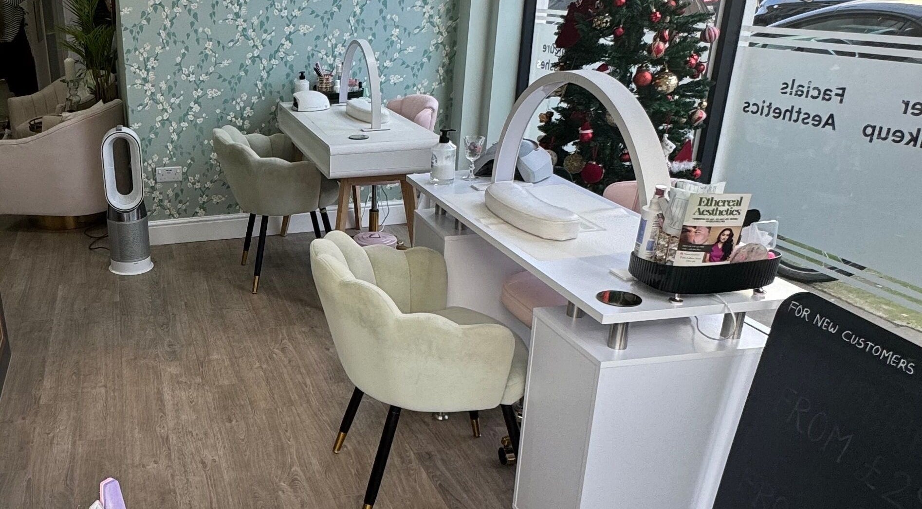 Modern beauty station at GLAM FACES CLINIC, London, England, GB with elegant chairs and decor.