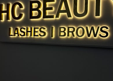 Illuminated sign of Hannah Coombs beauty in Brighton And Hove, England, GB highlighting lashes and brows.