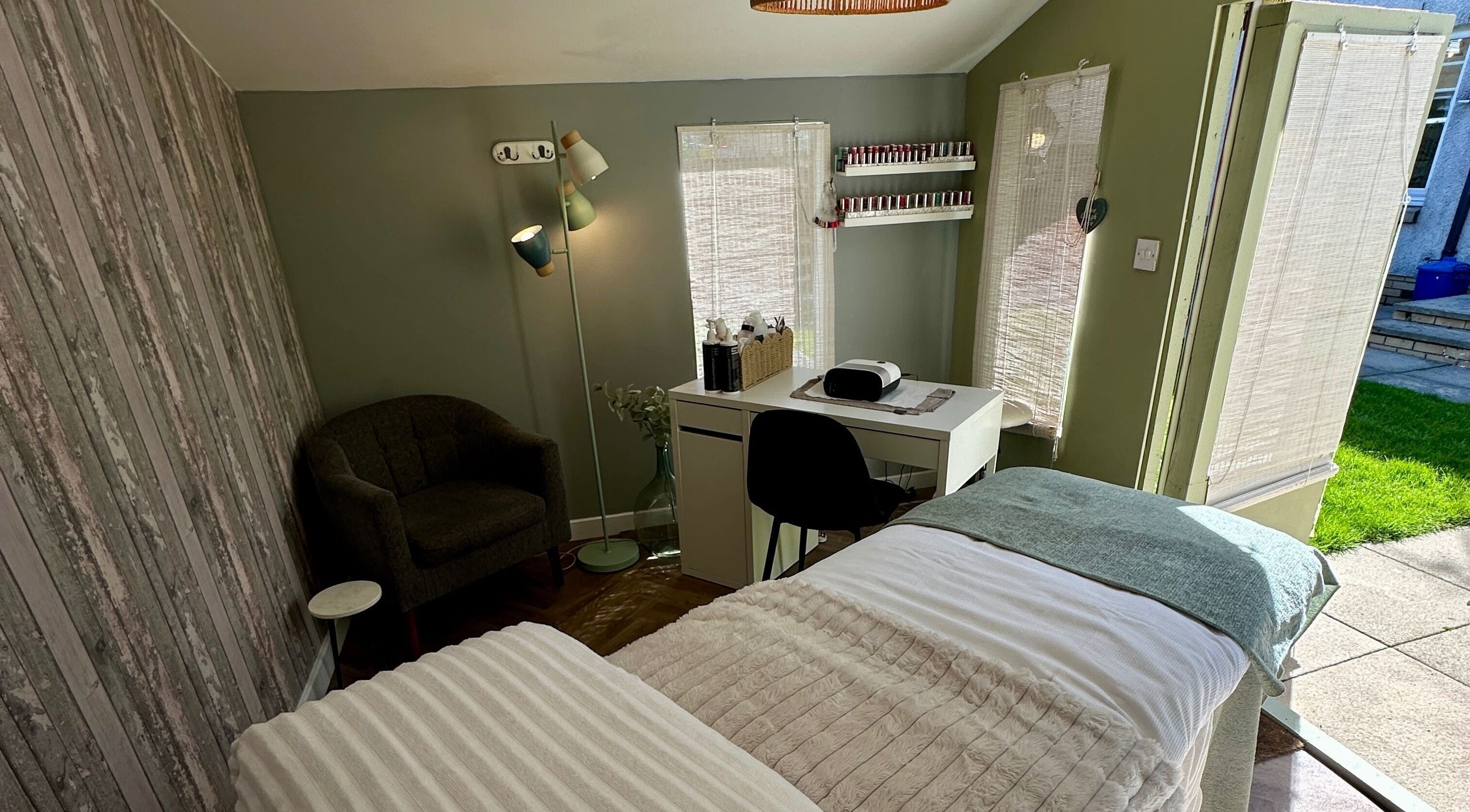 Relaxing treatment room at Angel Beauty & Holistic’s, Menstrie, Scotland, GB with cozy chair and sunlight.