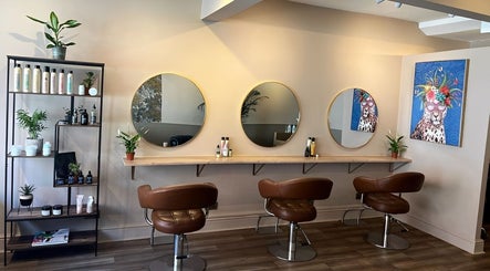 Stylish hair salon at Forté, Louth, England, GB with elegant mirrors and chairs for a luxury beauty experience.