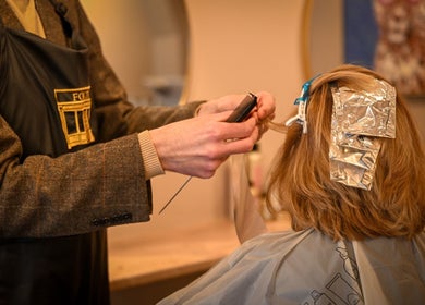 Stylist foiling hair at Forté in Louth, England, GB, showcasing expert hair coloring techniques.