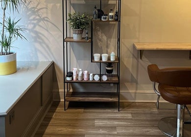 Chic salon corner at Forté, Louth, England, GB with beauty products, plants, and a stylish chair.