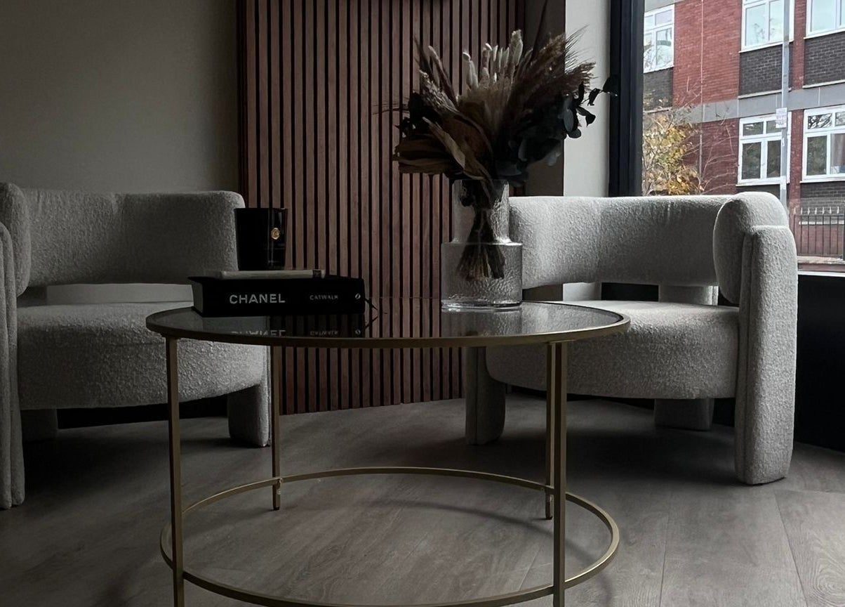 Chic seating area in Lux Beauty, Cannock, England, GB with plush chairs and a stylish table.