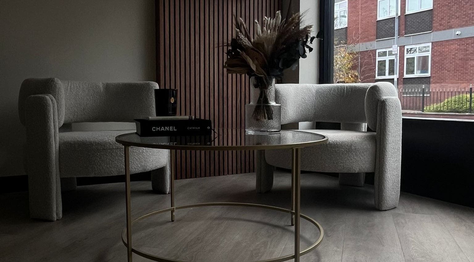 Chic seating area in Lux Beauty, Cannock, England, GB with plush chairs and a stylish table.