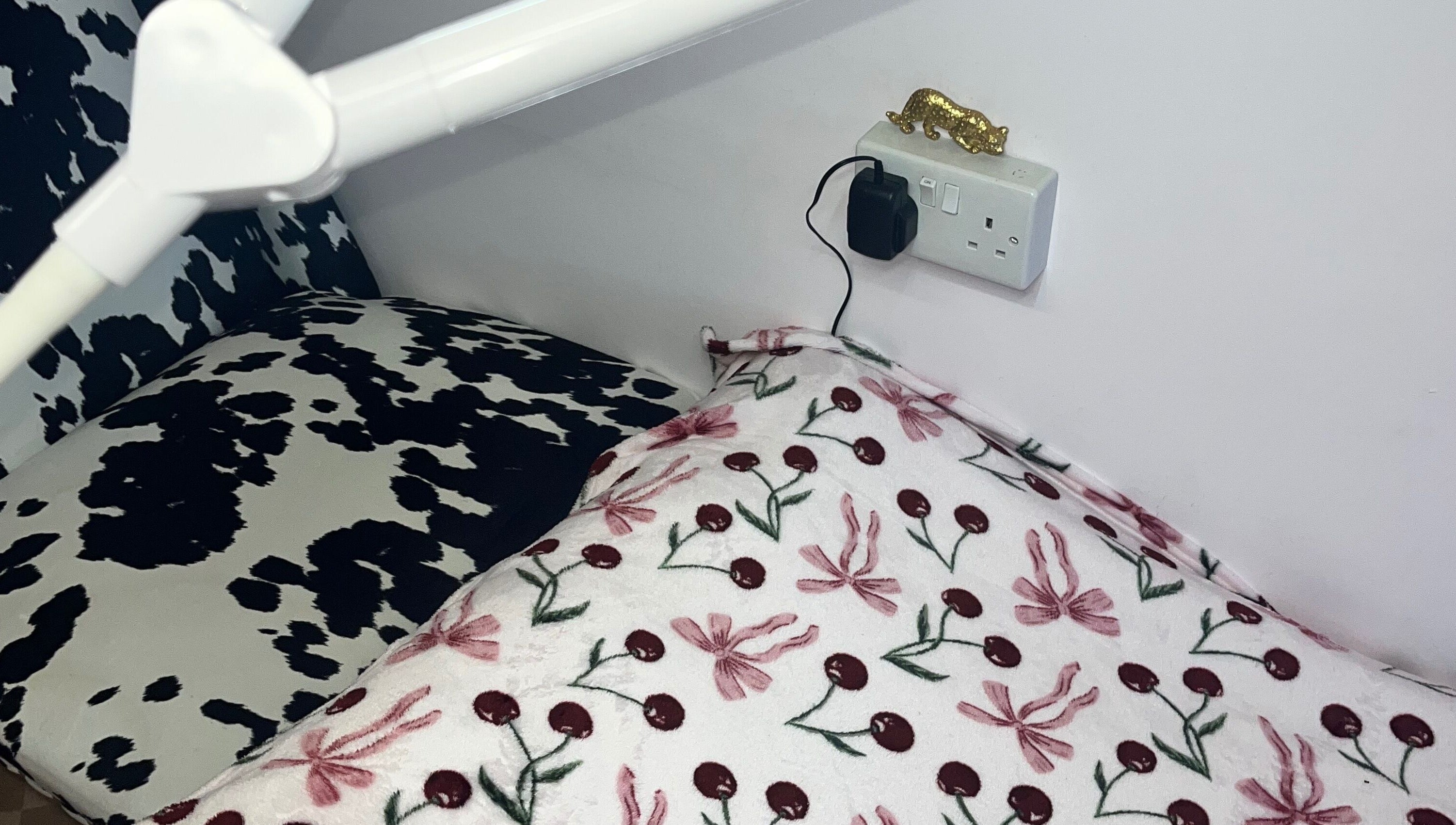 Comfortable seating area at PA Beauty, Highworth, England, GB, with floral and cow-print patterns.