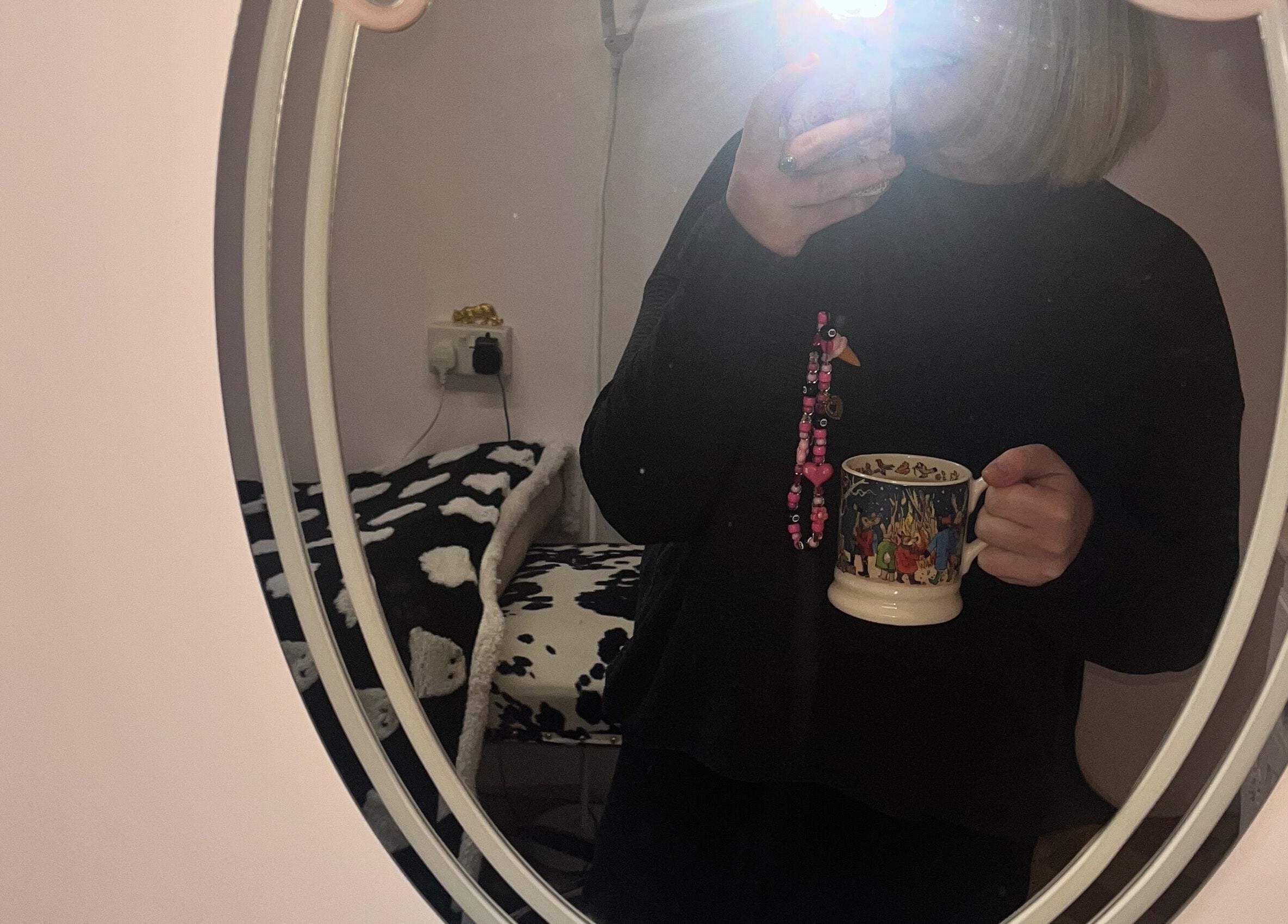 Cozy room interior at PA Beauty, Highworth, England, GB with soft lighting and a decorative mirror.