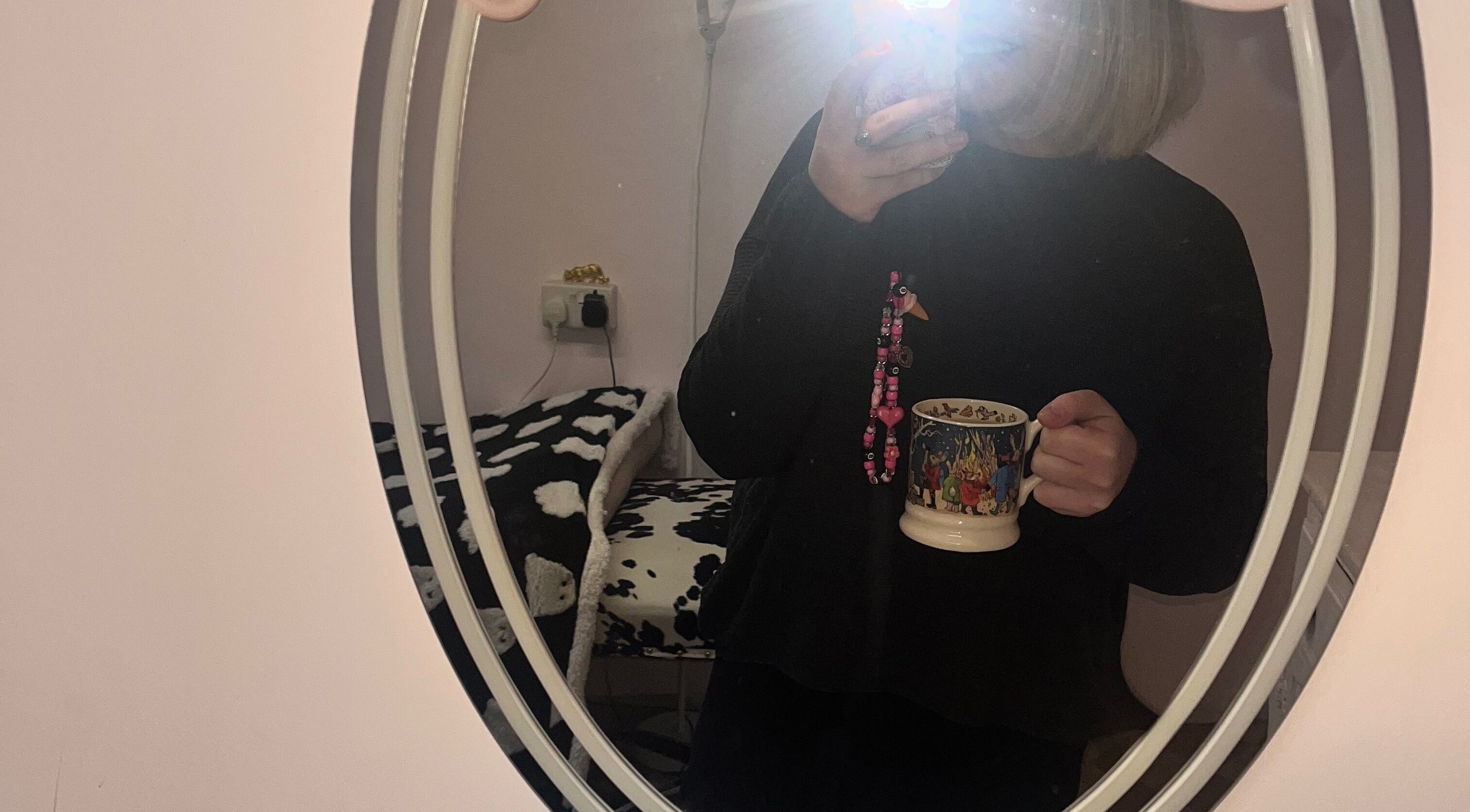 Cozy room interior at PA Beauty, Highworth, England, GB with soft lighting and a decorative mirror.