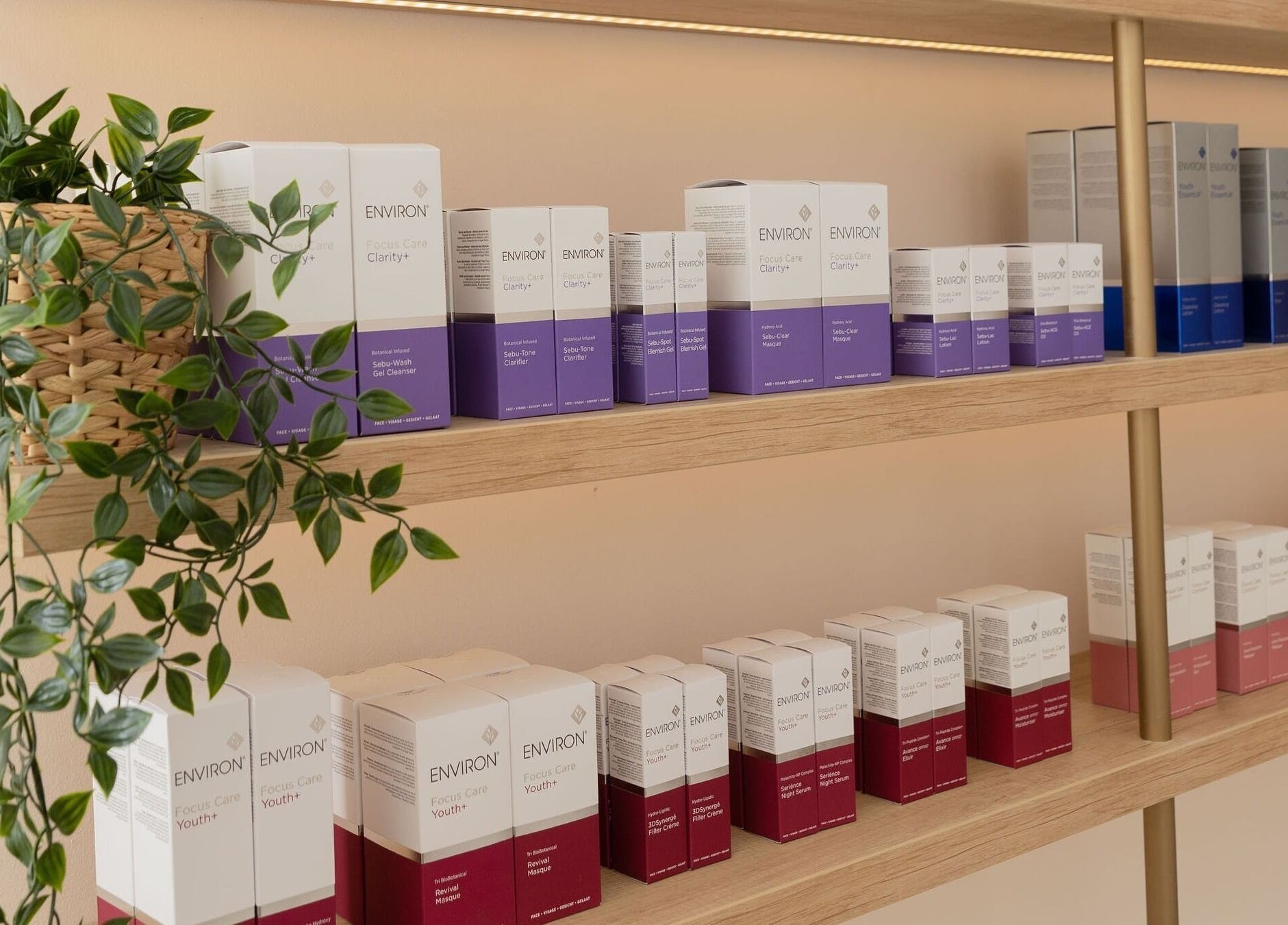 Product display at Fountain of Youth in Ħal Balzan, MT, showcasing skincare items on wooden shelves.