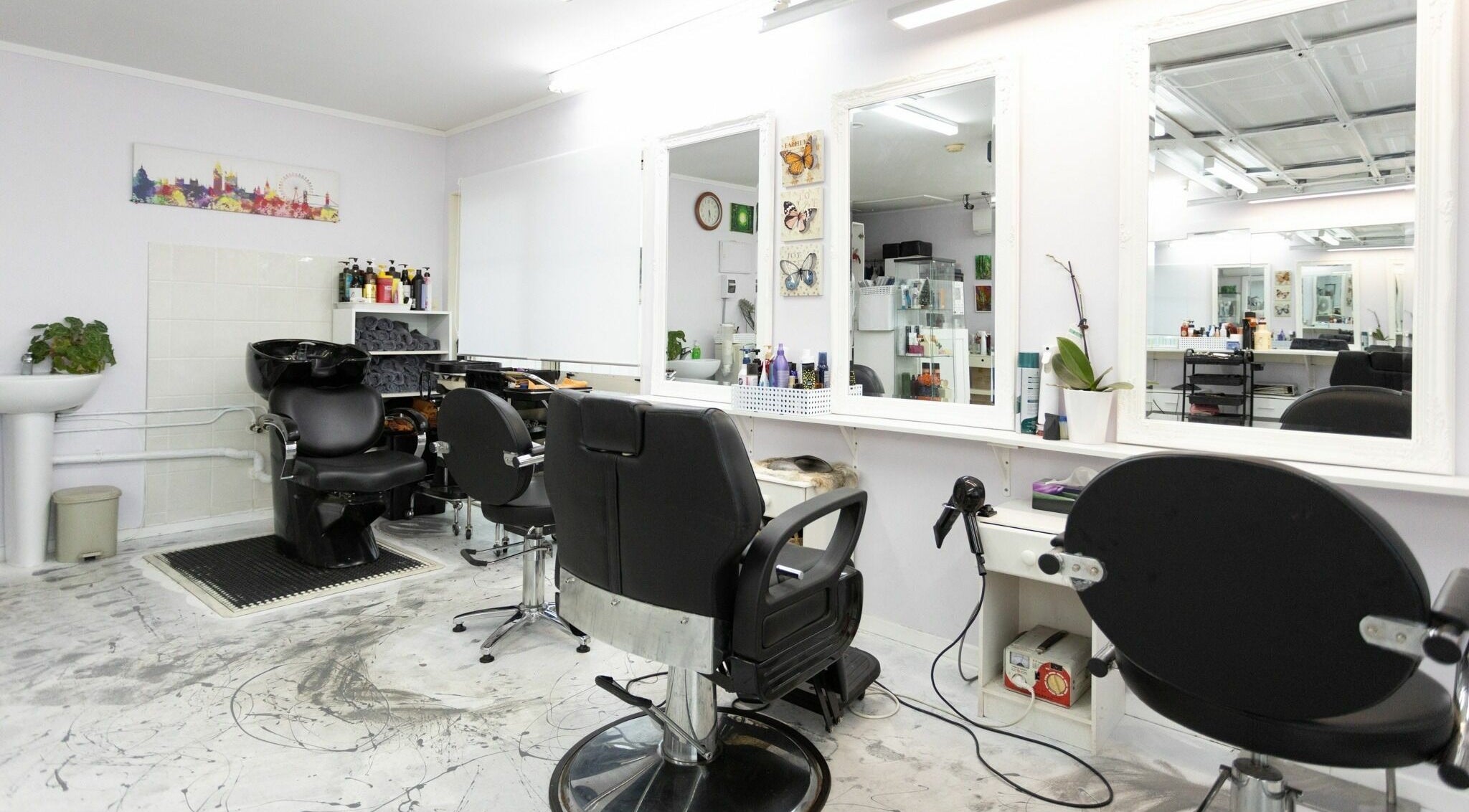 Chic interior of Dane Hair in Auckland, Auckland, NZ, showcasing sleek styling chairs and modern décor.