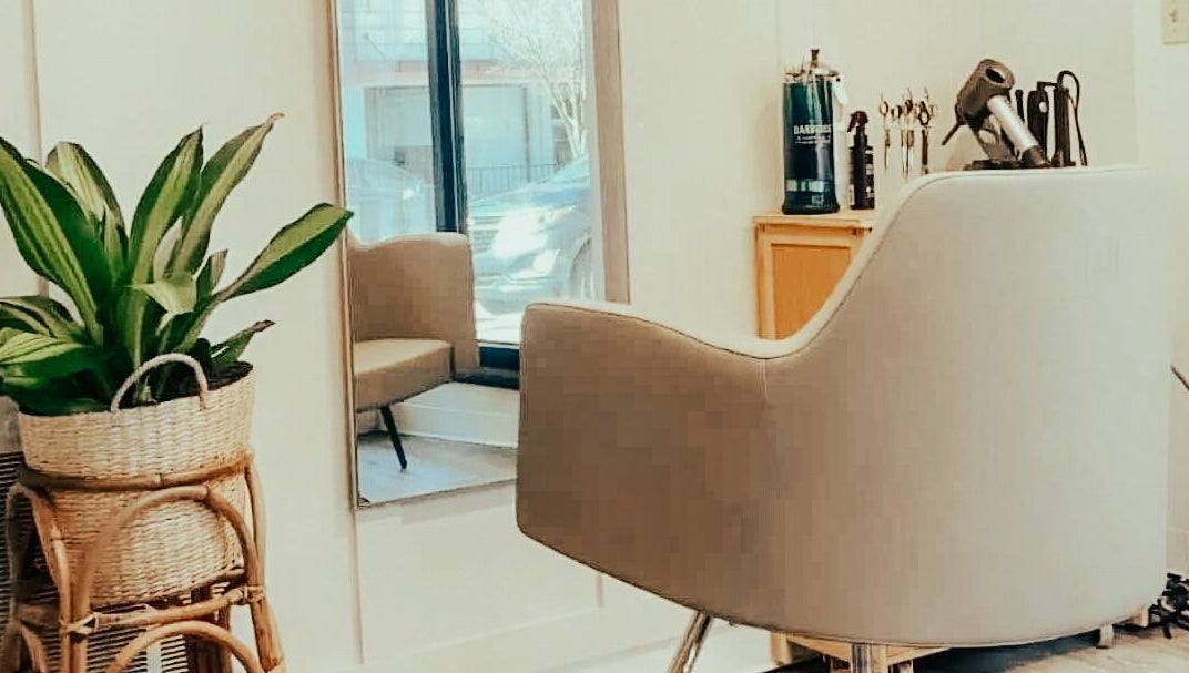 Stylish salon chair and mirror at Glow Massage and Esthetics, Pottsville, Pennsylvania, US.