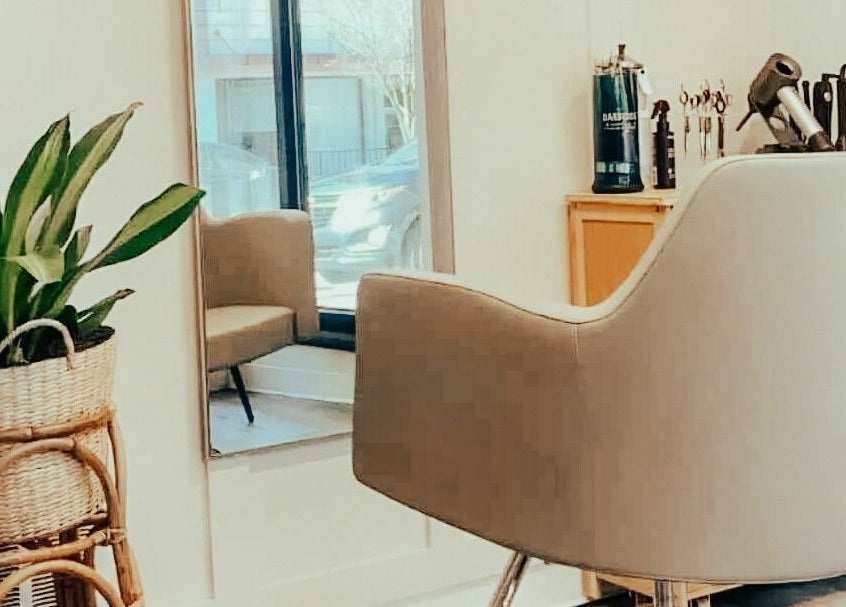 Stylish salon chair and mirror at Glow Massage and Esthetics, Pottsville, Pennsylvania, US.