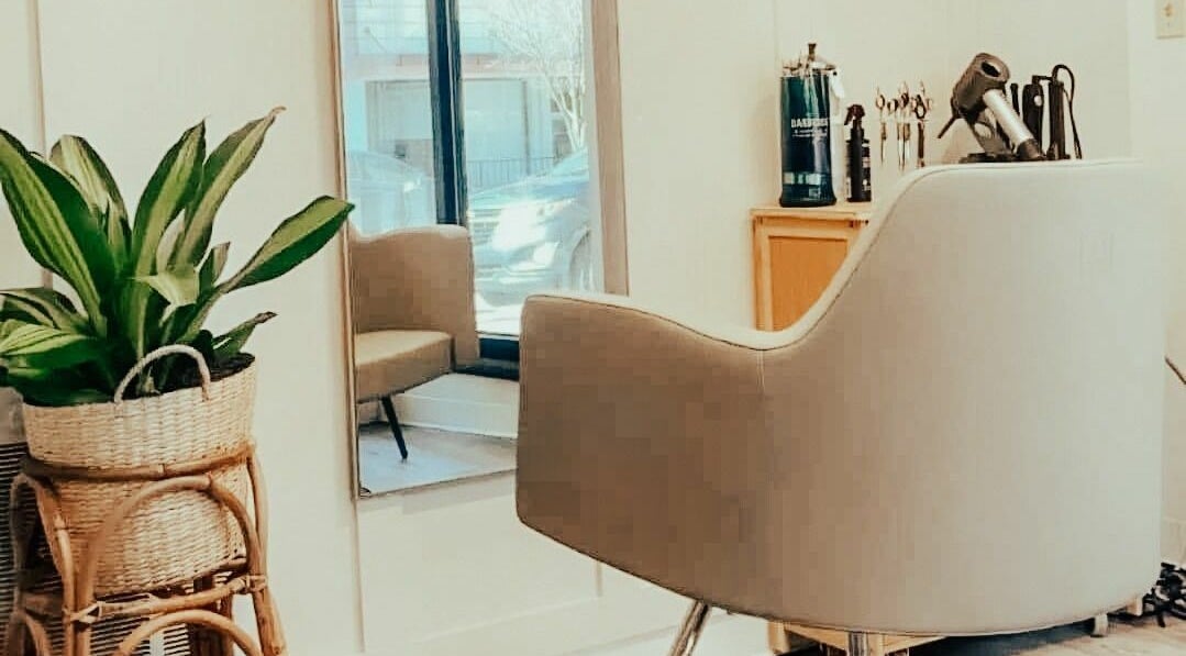 Stylish salon chair and mirror at Glow Massage and Esthetics, Pottsville, Pennsylvania, US.