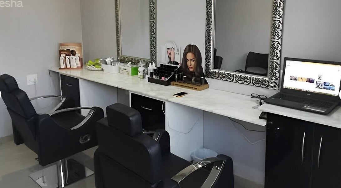 Modern beauty salon station at Roop Beauty and Threading, Centurion, Gauteng, ZA with stylish chairs and mirrors.