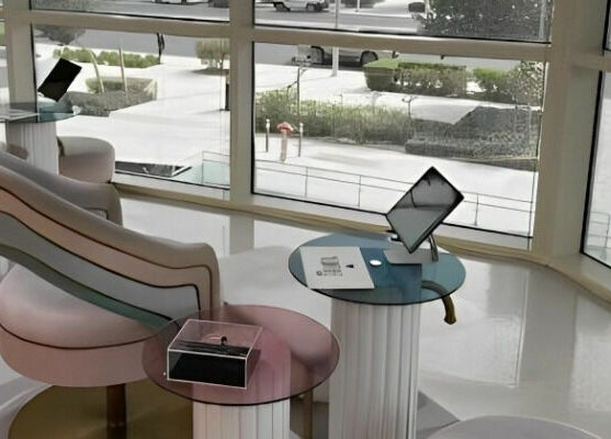 Modern lounge at Le Meme Spa, Manarat Lusail Tower, Doha, Doha, QA with comfy seating and large windows.