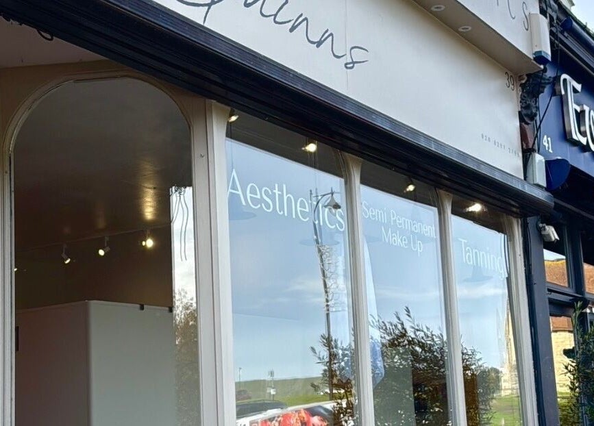 Exterior of Quinns Tanning and Aesthetics in London, England, GB showcasing elegant design.