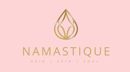 Namastique logo featuring elegant design in pink backdrop, Hull, England, GB.
