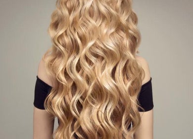 Flowing blonde waves at The Hair Workshop Extensions Hair Couture, Dubai, Dubai, AE.