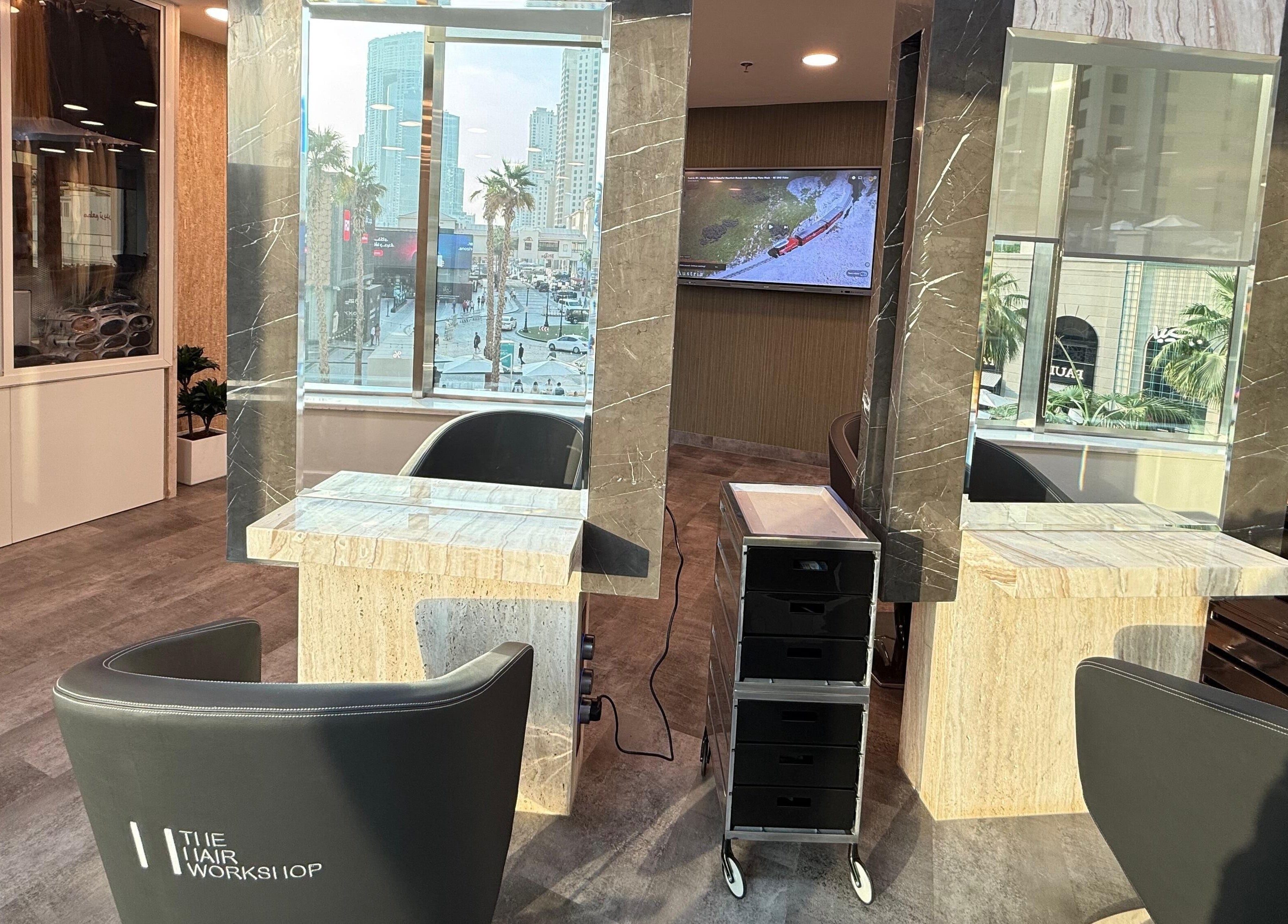 Modern salon interior at The Hair Workshop Extensions Hair Couture, Dubai, Dubai, AE, with stylish seating.