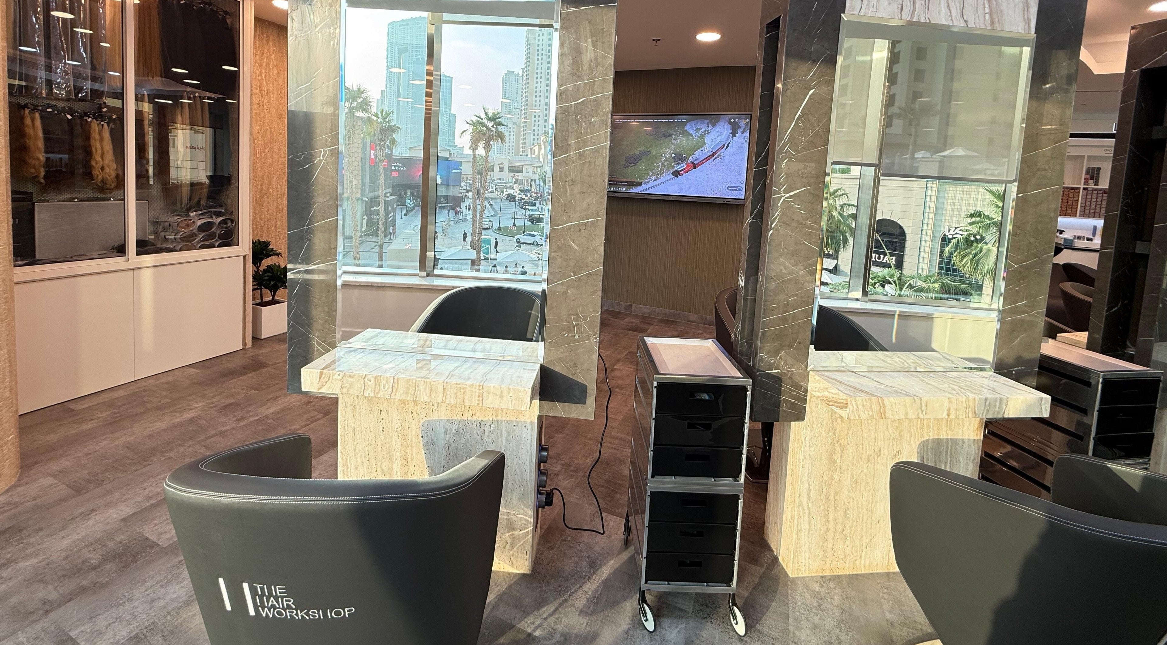 Modern salon interior at The Hair Workshop Extensions Hair Couture, Dubai, Dubai, AE, with stylish seating.