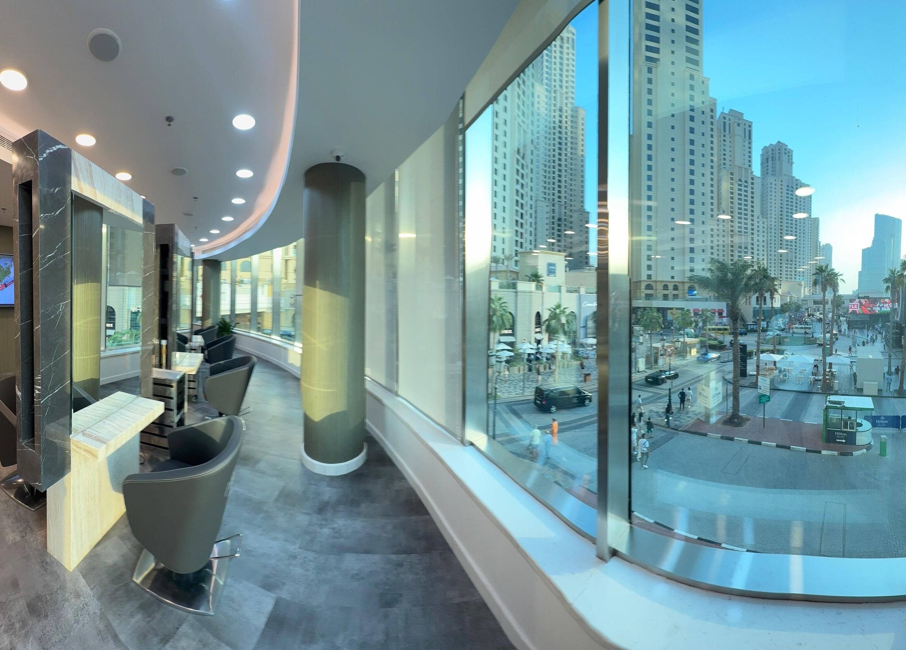 Chic interior of The Hair Workshop Extensions Hair Couture with city view in Dubai, Dubai, AE.