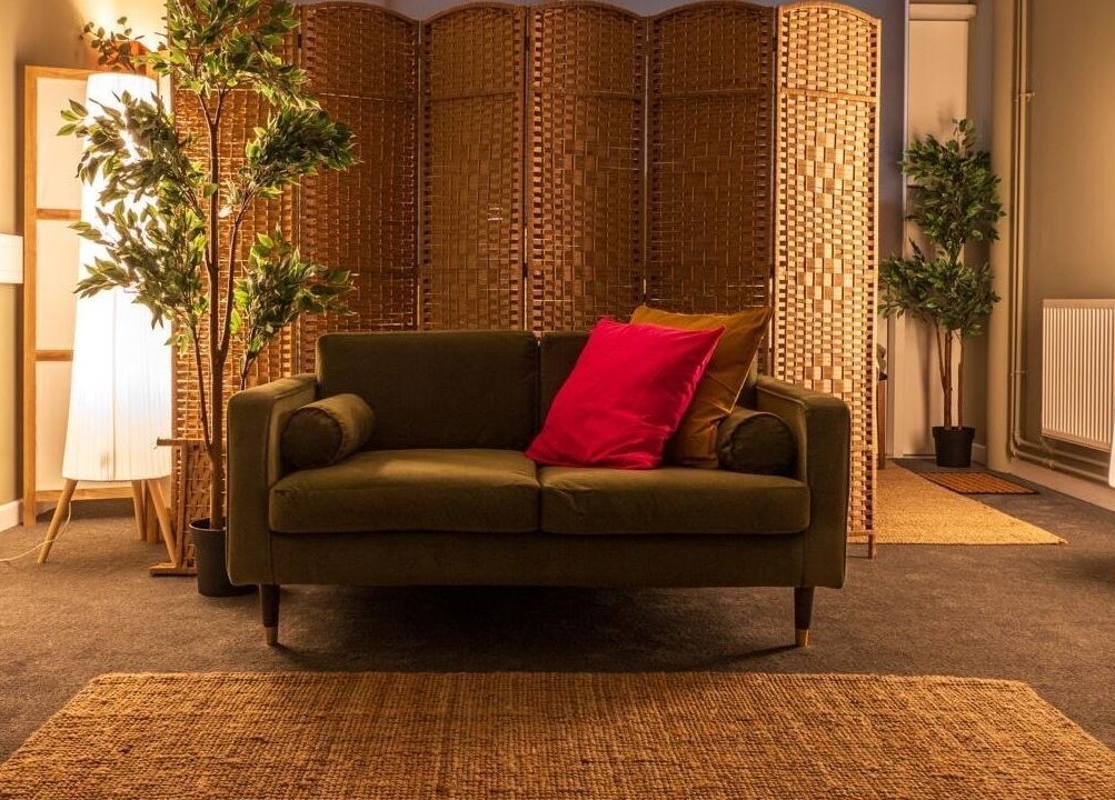 Cozy seating area at Heal Studio (formerly Bathhaus Spa) London, England, GB, with warm lighting and plants.