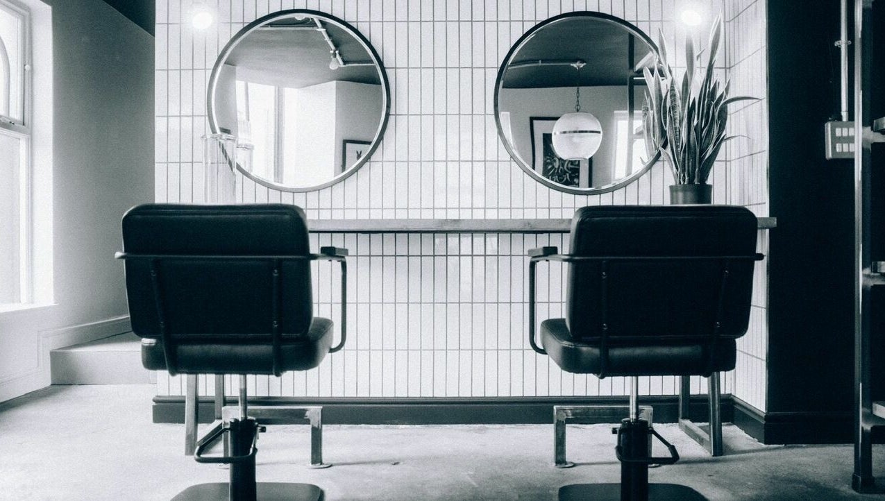 Elegant salon chairs and mirrors inside Blake Edwards in Leicester, England, GB.