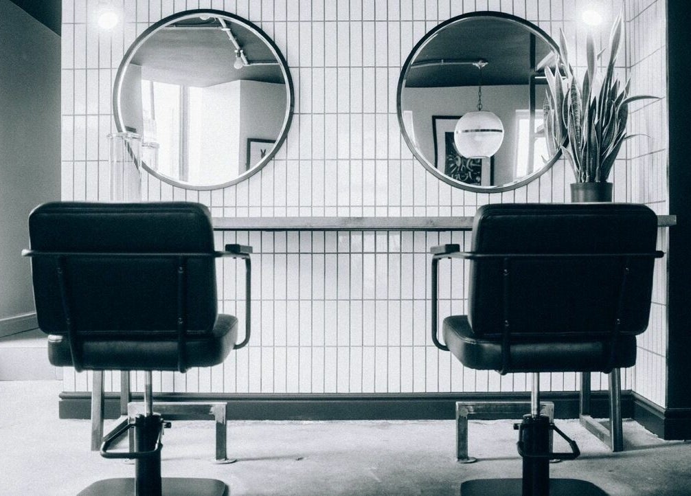 Elegant salon chairs and mirrors inside Blake Edwards in Leicester, England, GB.