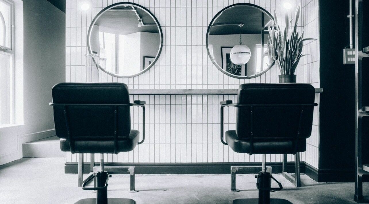 Elegant salon chairs and mirrors inside Blake Edwards in Leicester, England, GB.