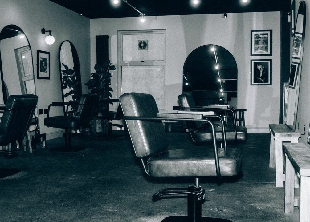 Modern salon chairs and mirrors at Blake Edwards, Leicester, England, GB, showcasing a sleek interior design.