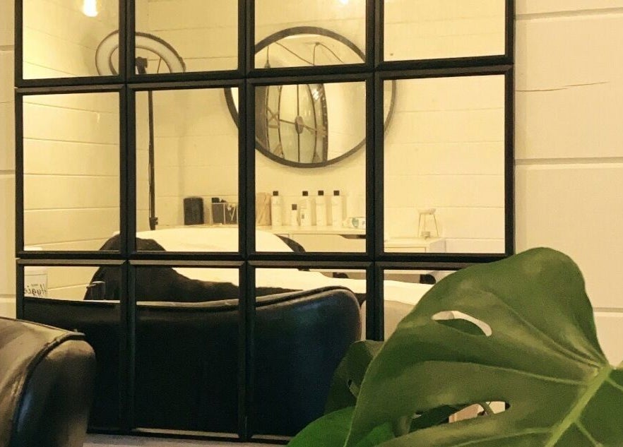 Elegant mirrors and chic chairs at Bombshell Boutique Beauty, Bracknell, England, GB.