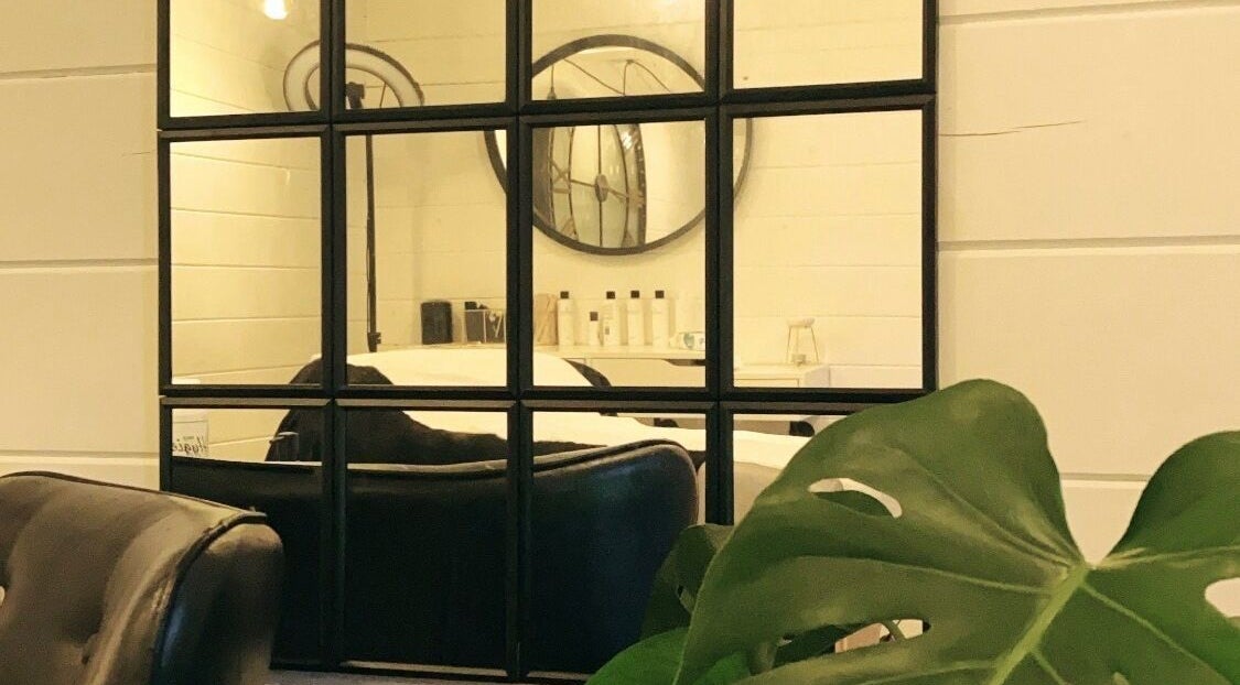 Elegant mirrors and chic chairs at Bombshell Boutique Beauty, Bracknell, England, GB.