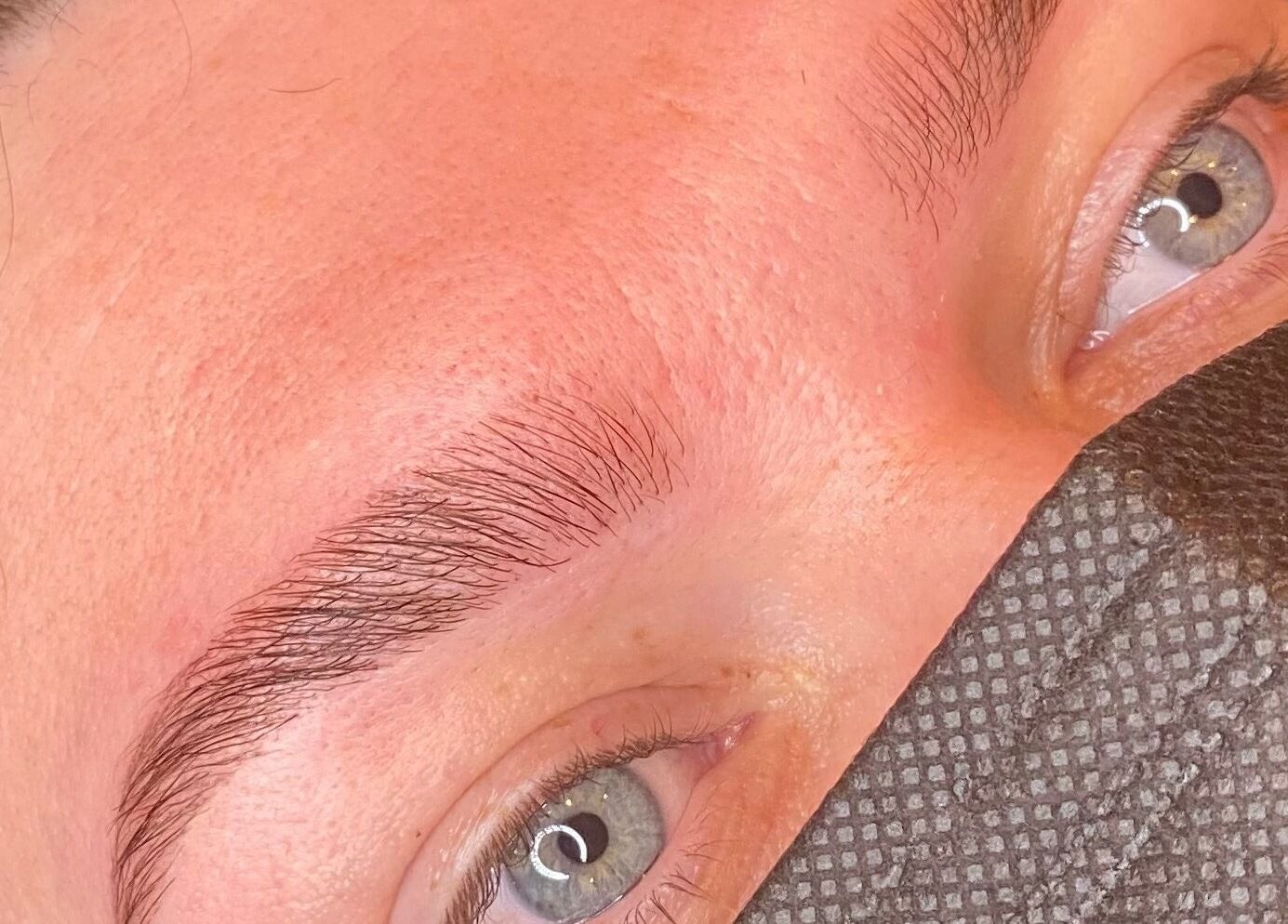 Close-up of perfectly shaped eyebrows at Bombshell Boutique Beauty, Bracknell, England, GB.